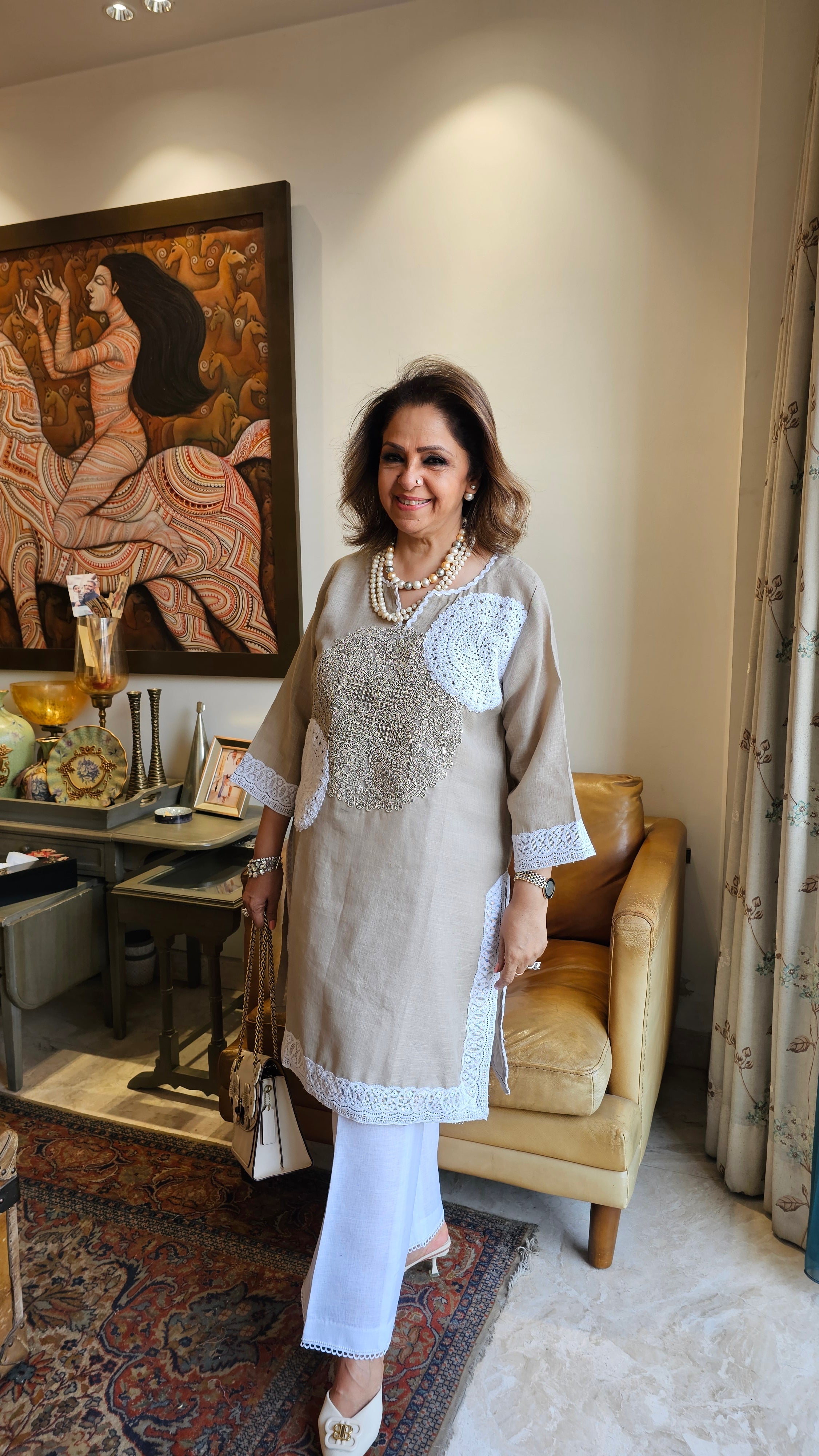 Beautiful Beige Linen dori embroidery top with lace work teamed with plain linen pants trimmed with lace