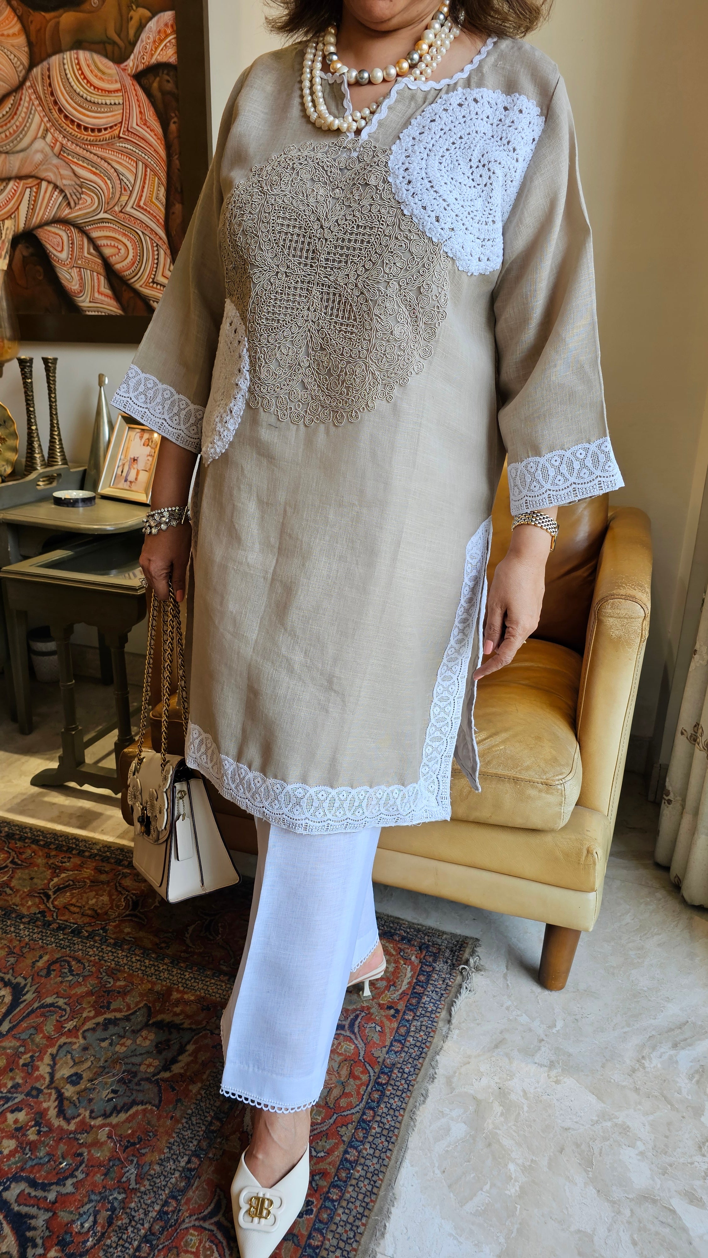 Beautiful Beige Linen dori embroidery top with lace work teamed with plain linen pants trimmed with lace
