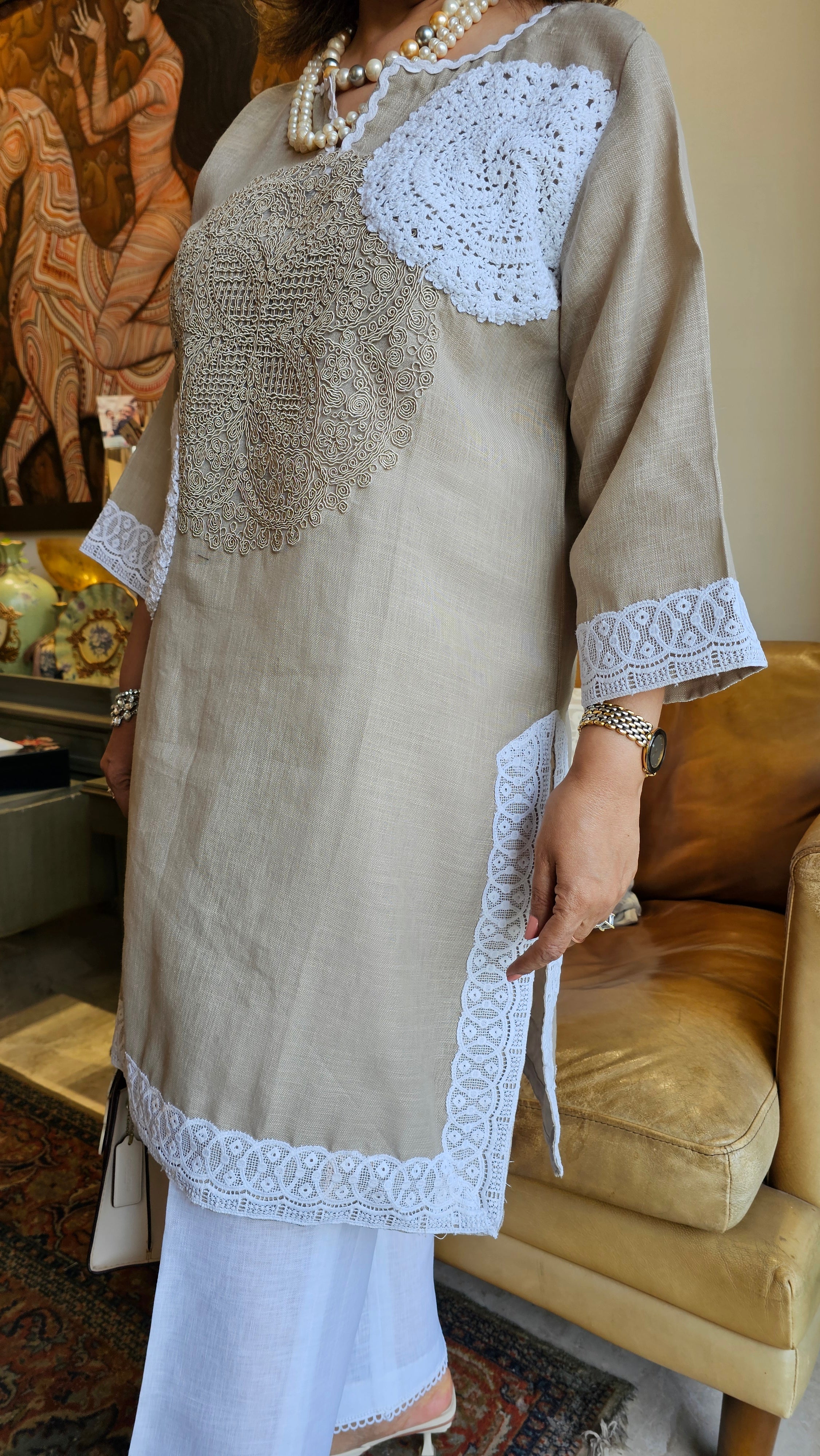 Beautiful Beige Linen dori embroidery top with lace work teamed with plain linen pants trimmed with lace