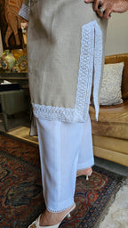 Beautiful Beige Linen dori embroidery top with lace work teamed with plain linen pants trimmed with lace