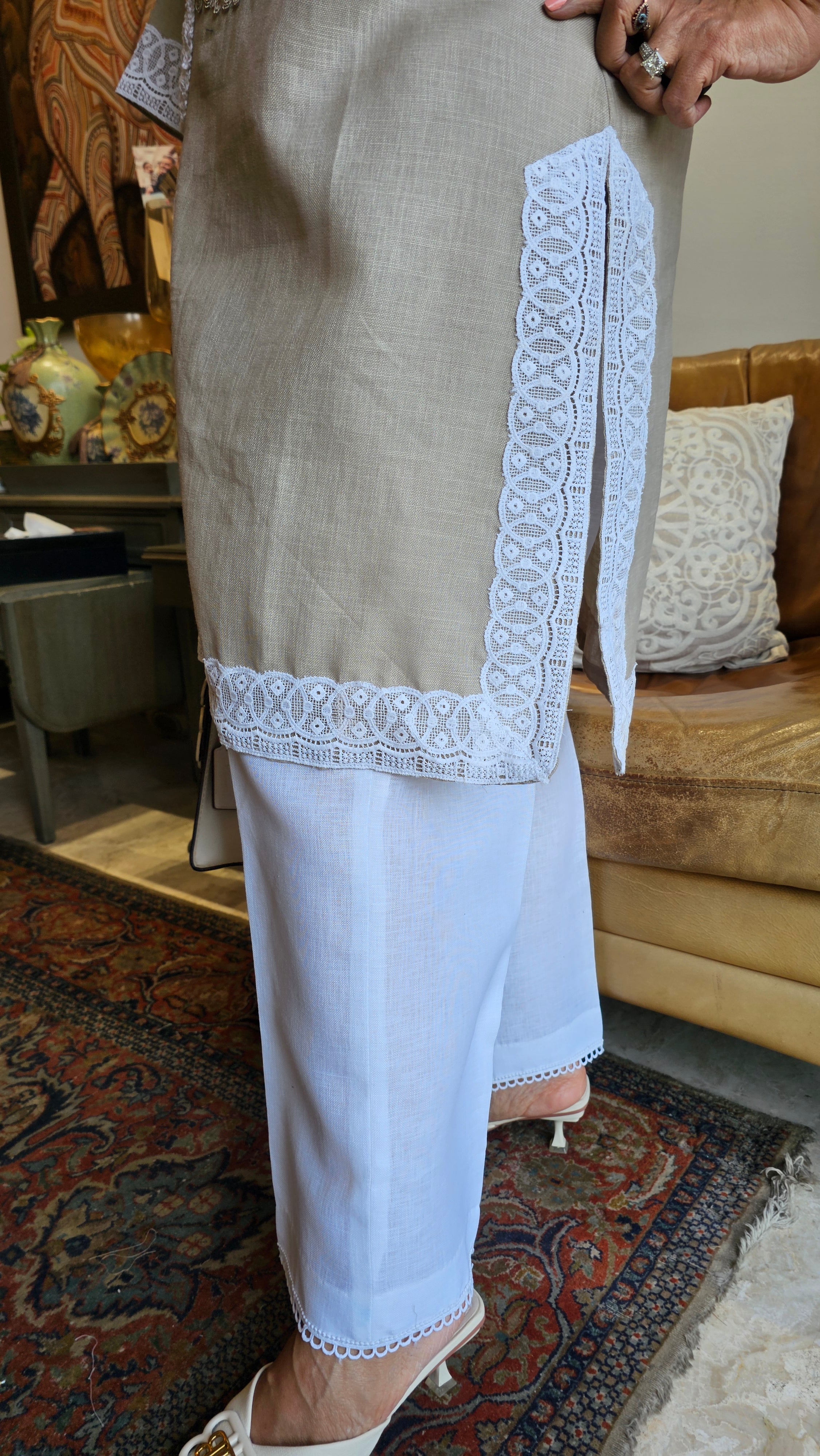 Beautiful Beige Linen dori embroidery top with lace work teamed with plain linen pants trimmed with lace