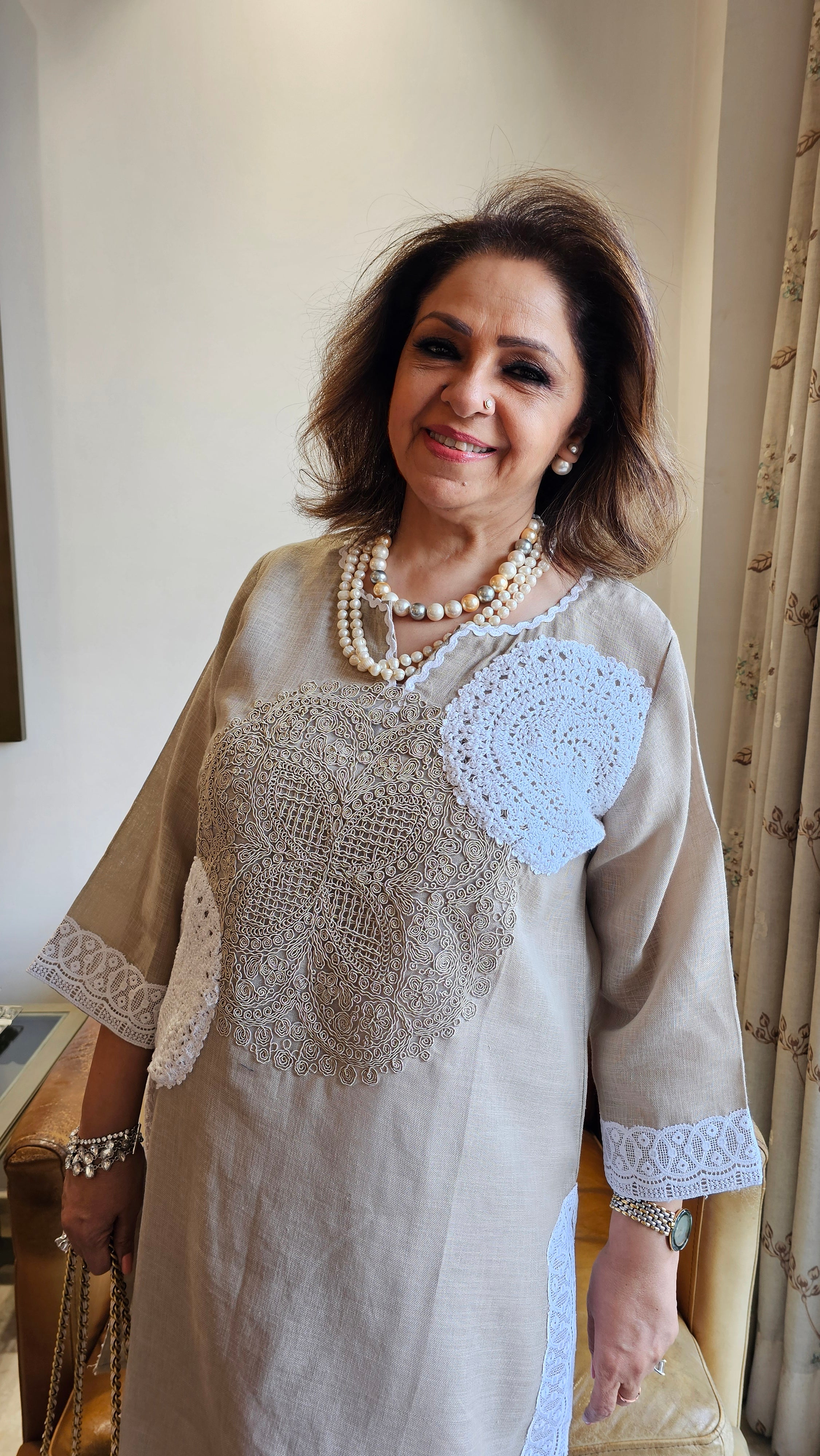 Beautiful Beige Linen dori embroidery top with lace work teamed with plain linen pants trimmed with lace