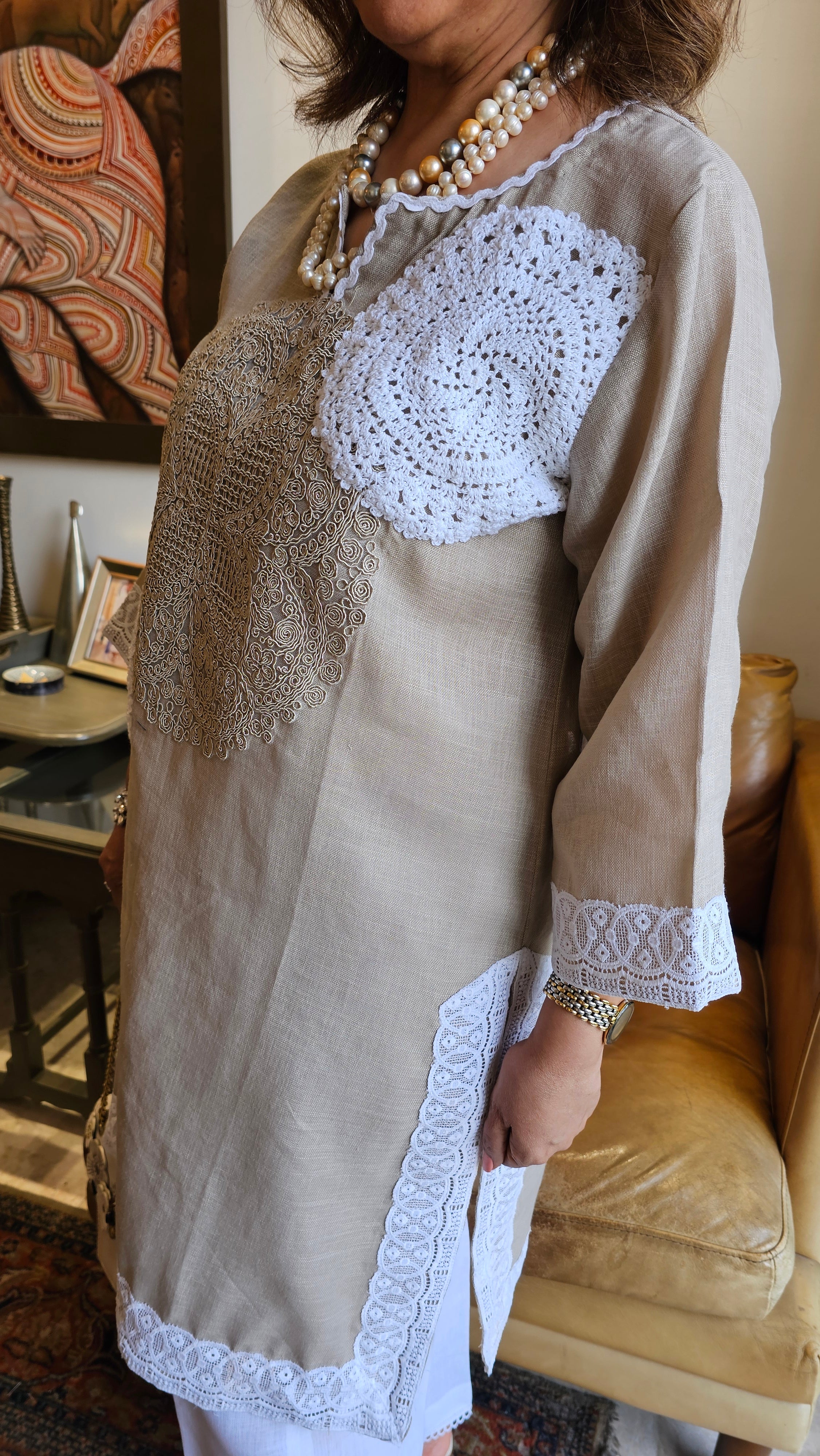 Beautiful Beige Linen dori embroidery top with lace work teamed with plain linen pants trimmed with lace