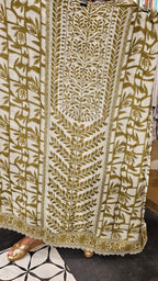 Beautiful Muslin Fabric Suit trimmed With Hand work