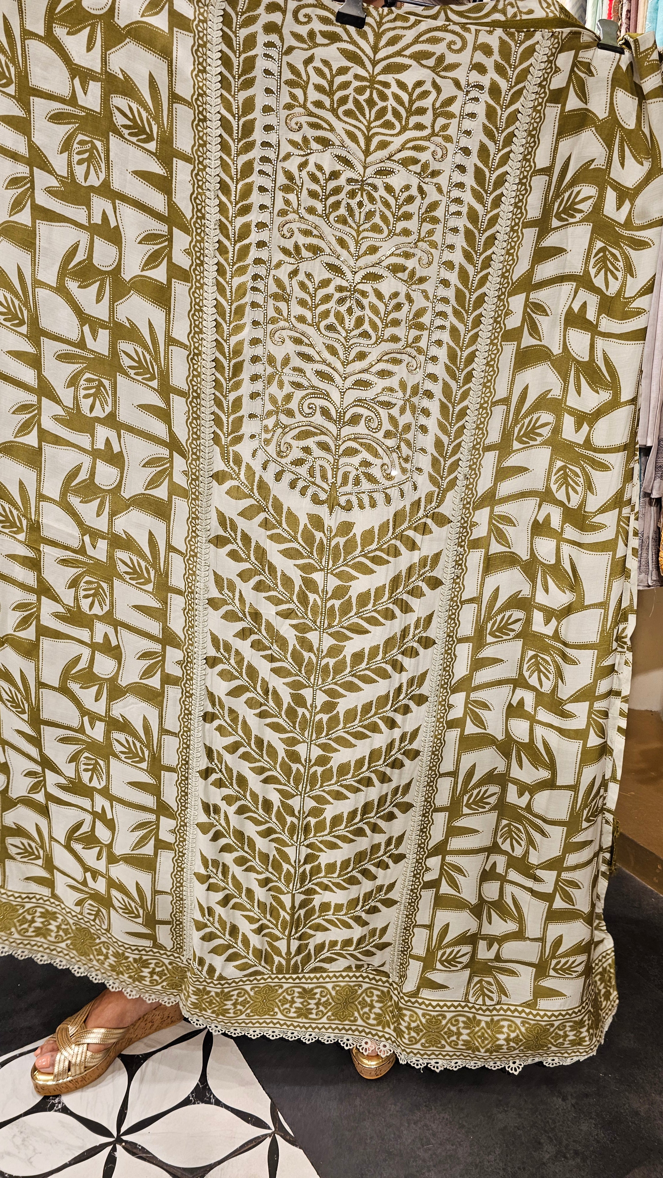Beautiful Muslin Fabric Suit trimmed With Hand work