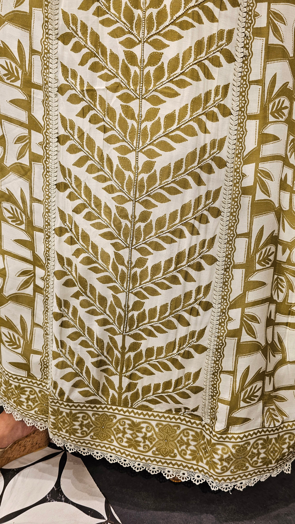 Beautiful Muslin Fabric Suit trimmed With Hand work