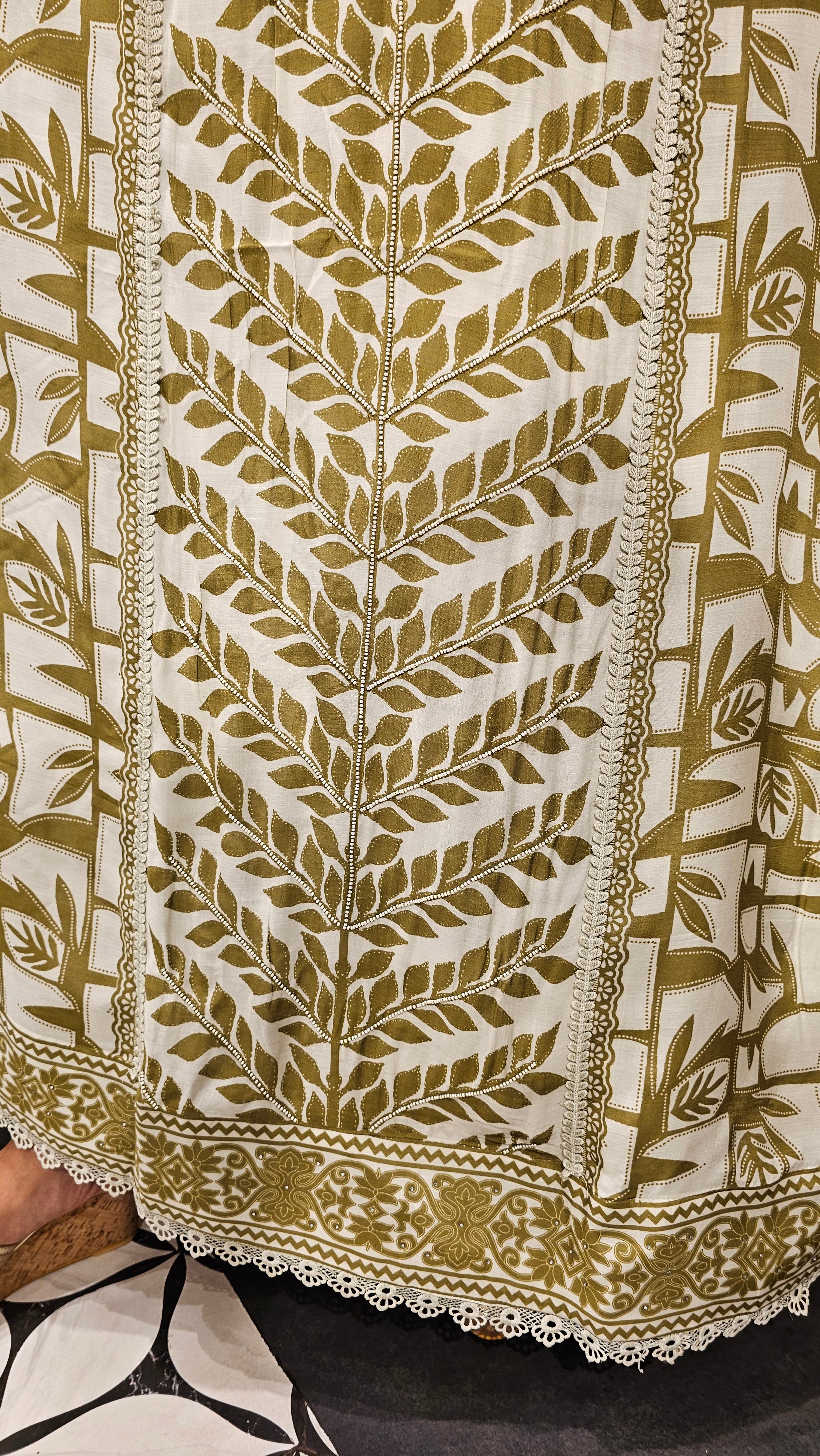 Beautiful Muslin Fabric Suit trimmed With Hand work