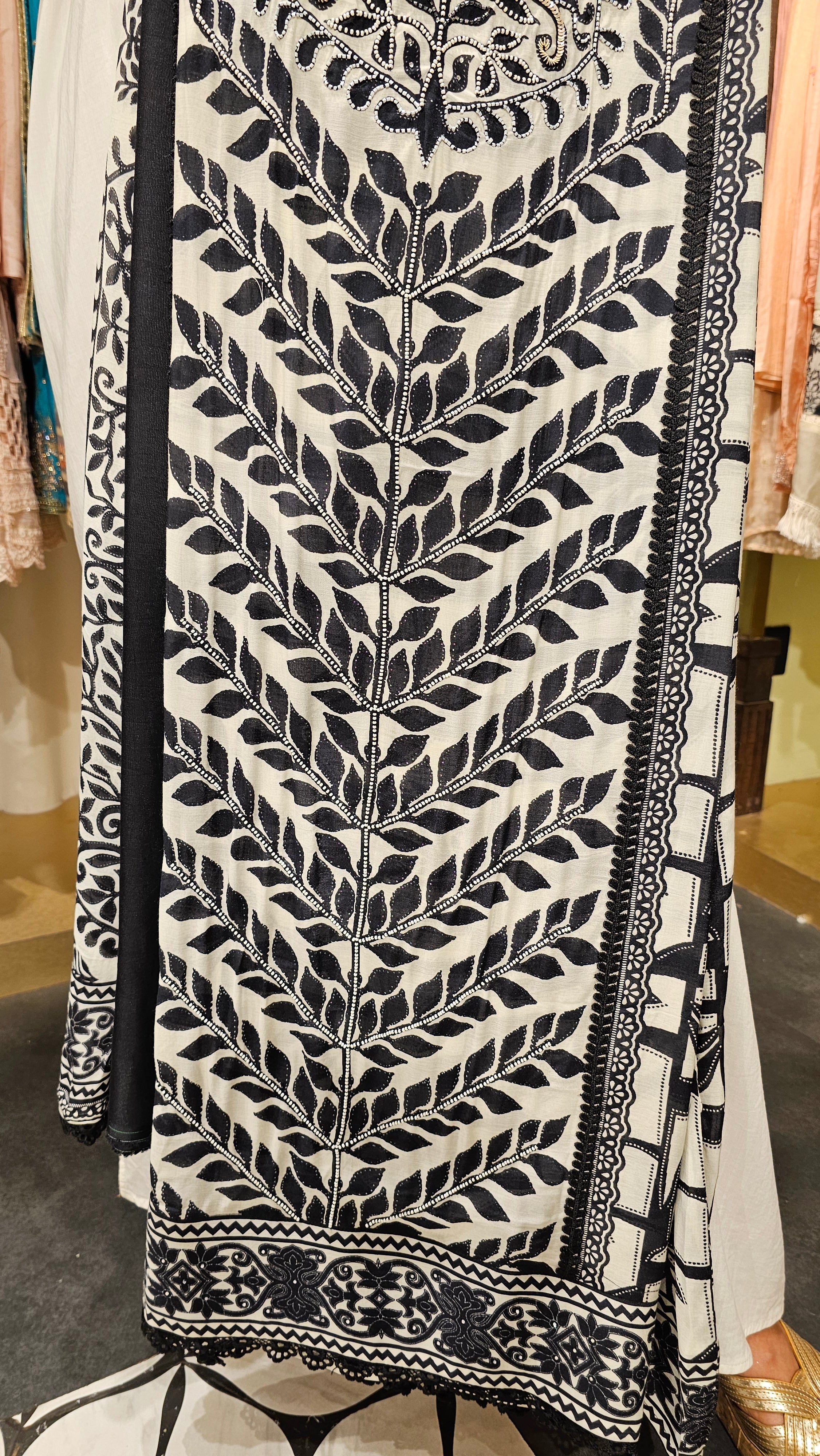 Beautiful Muslin Fabric Suit trimmed With Hand work