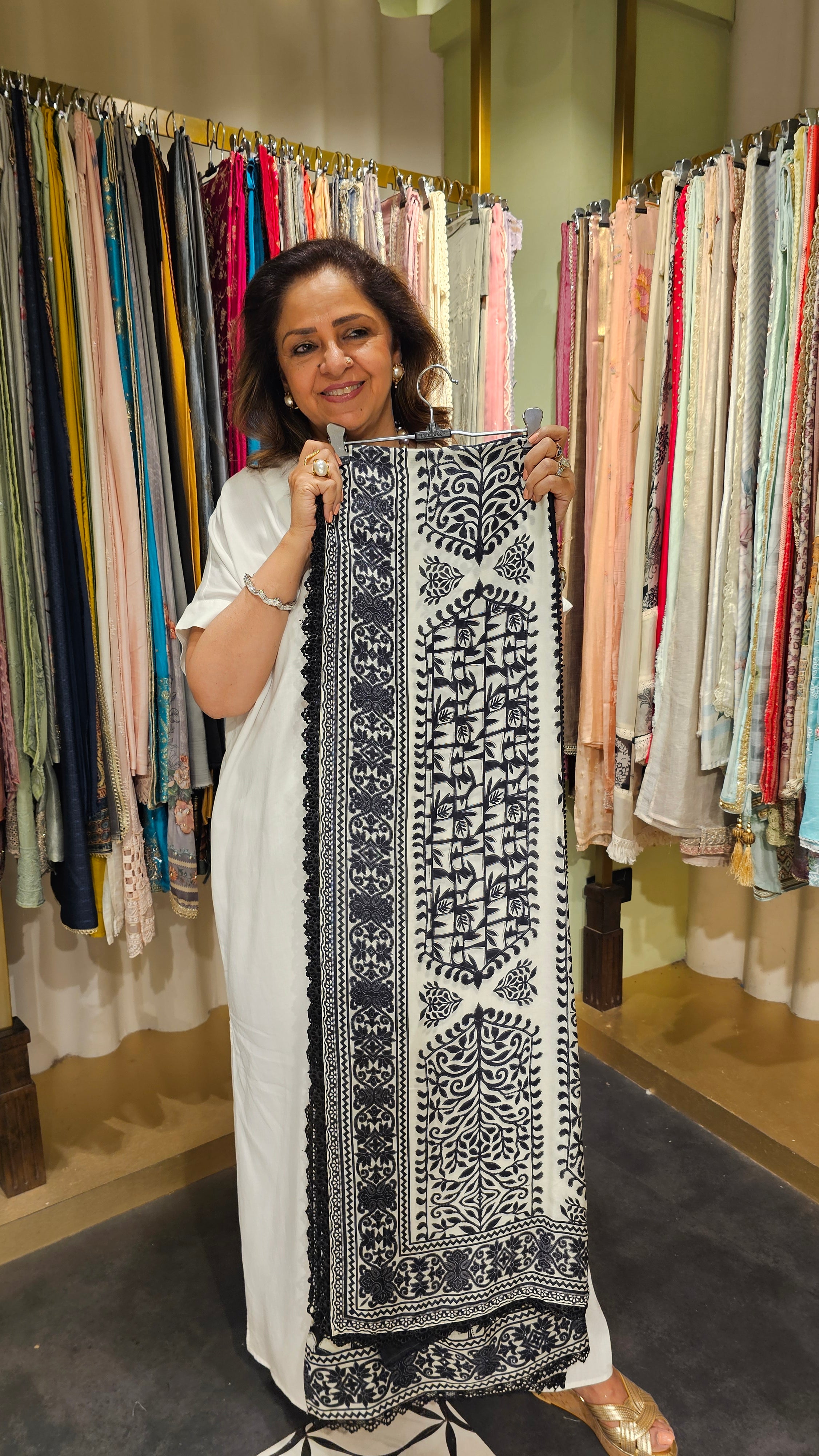 Beautiful Muslin Fabric Suit trimmed With Hand work