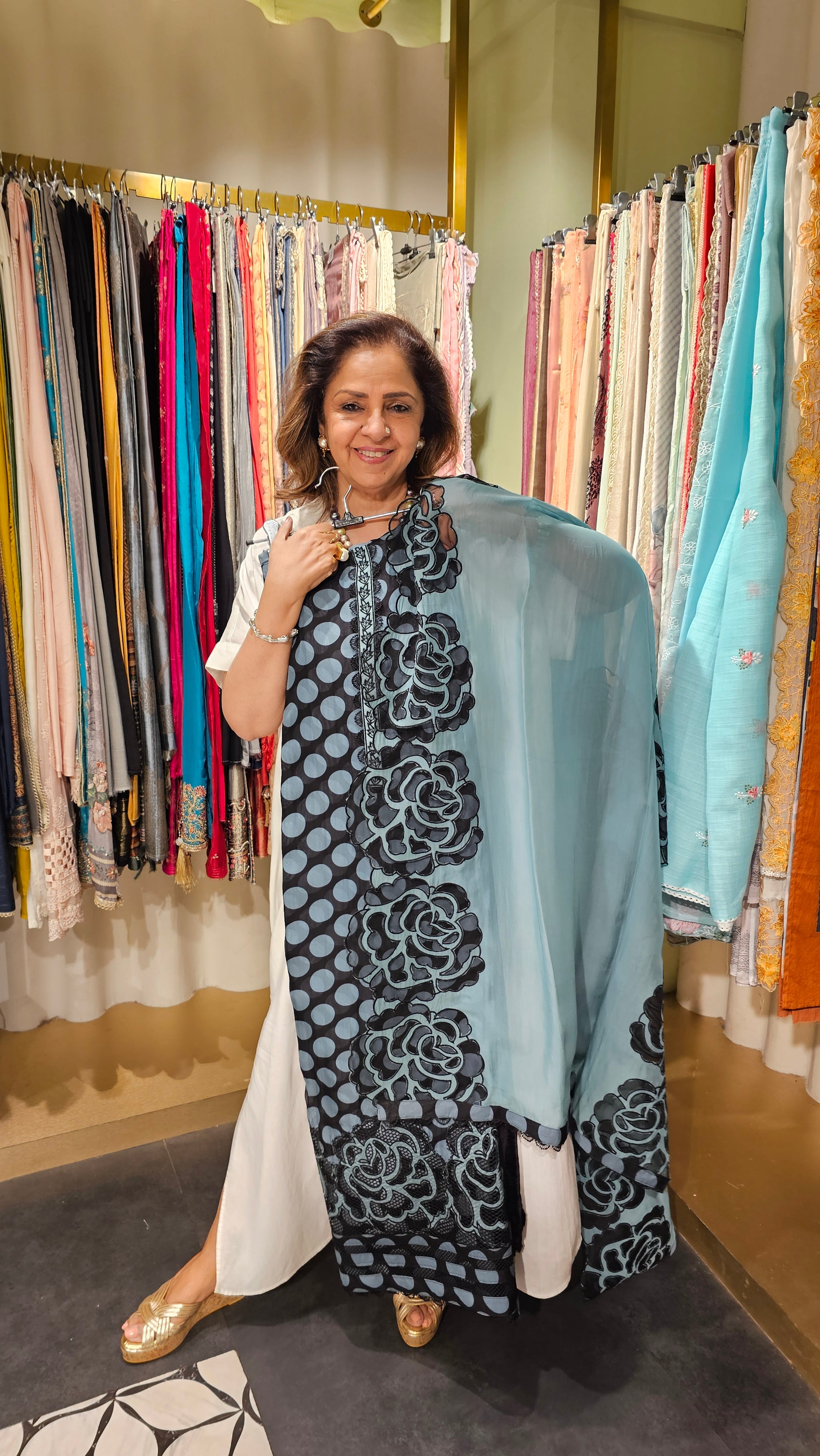 Beautiful Organza Fabric Suit trimmed With Floral Cut Work