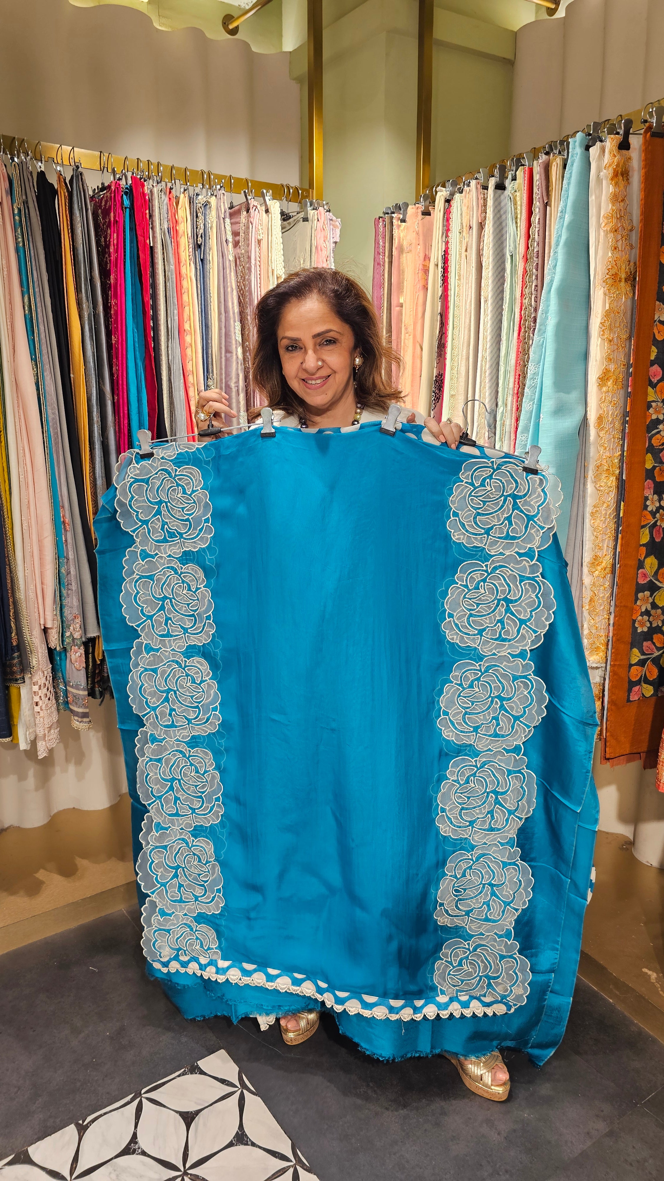 Beautiful Organza Fabric Suit trimmed With Floral Cut Work