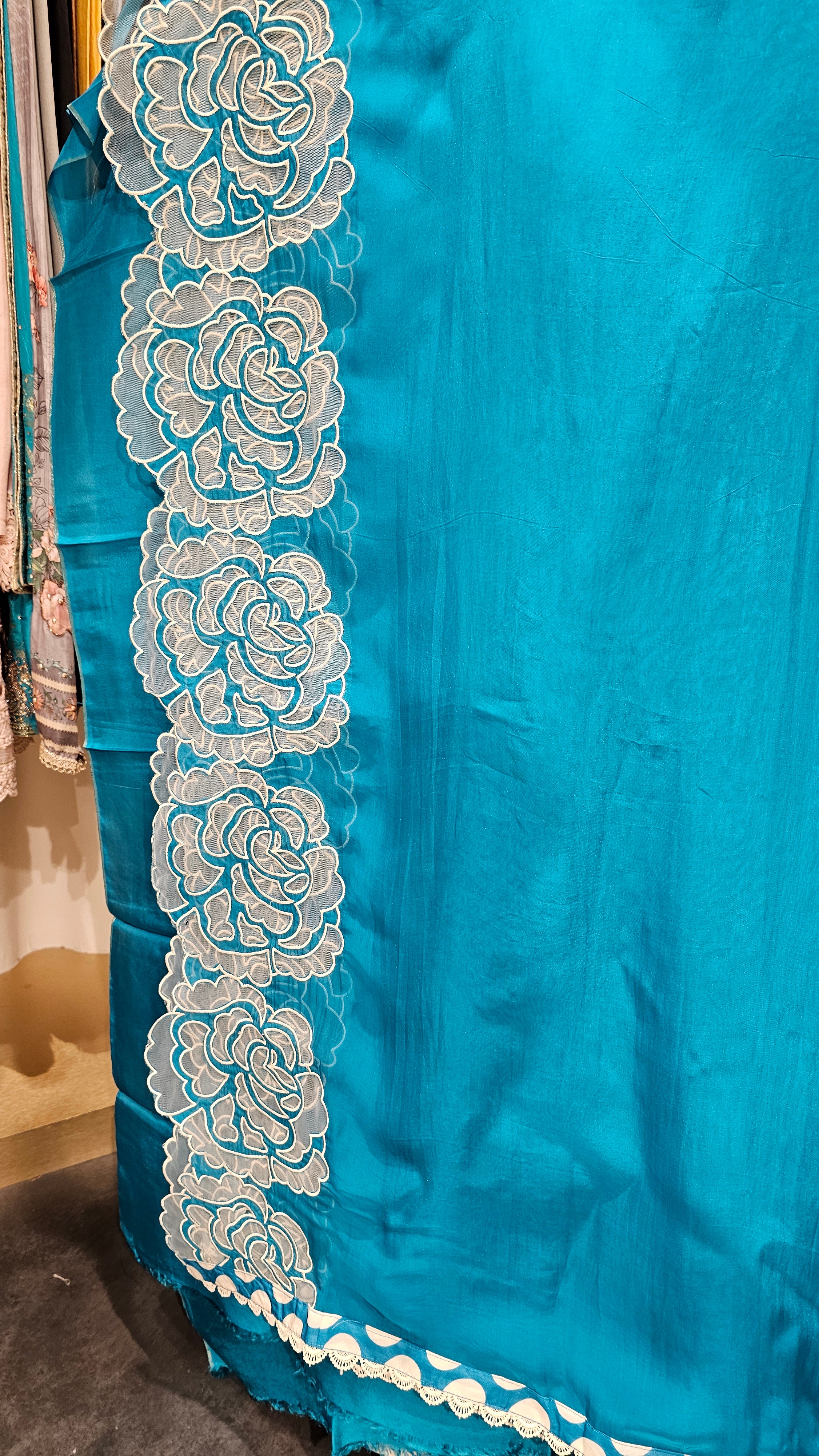 Beautiful Organza Fabric Suit trimmed With Floral Cut Work