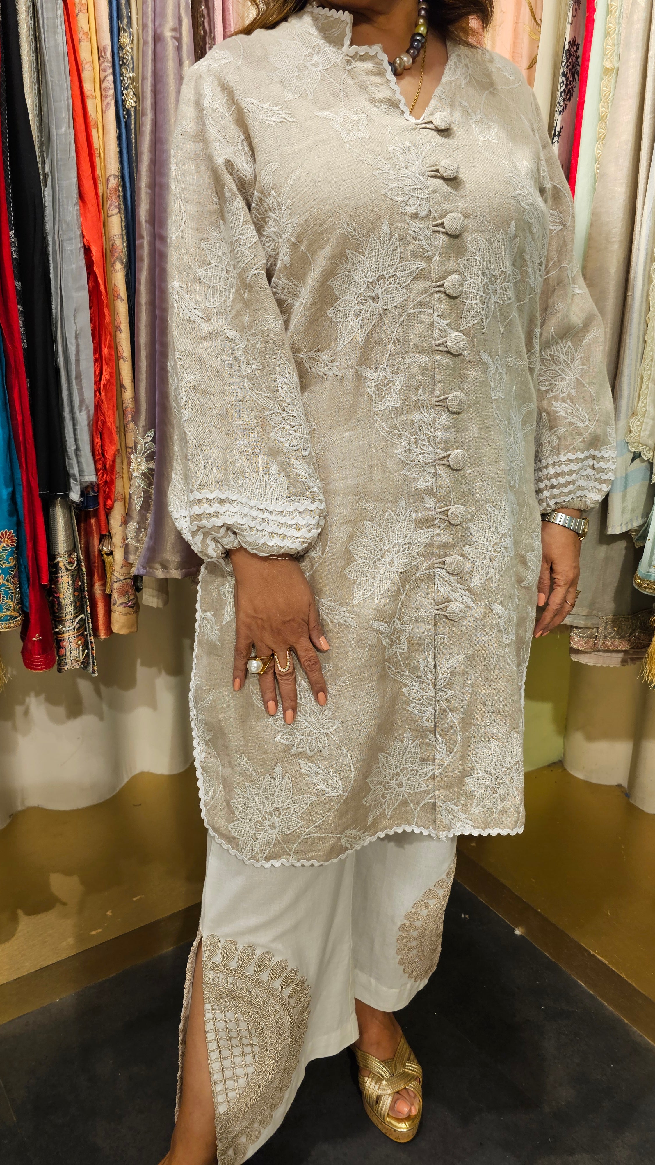 Cool and comfortable embroidered linen kurta dressed with dori work & laces with ivory linen pants with dori work