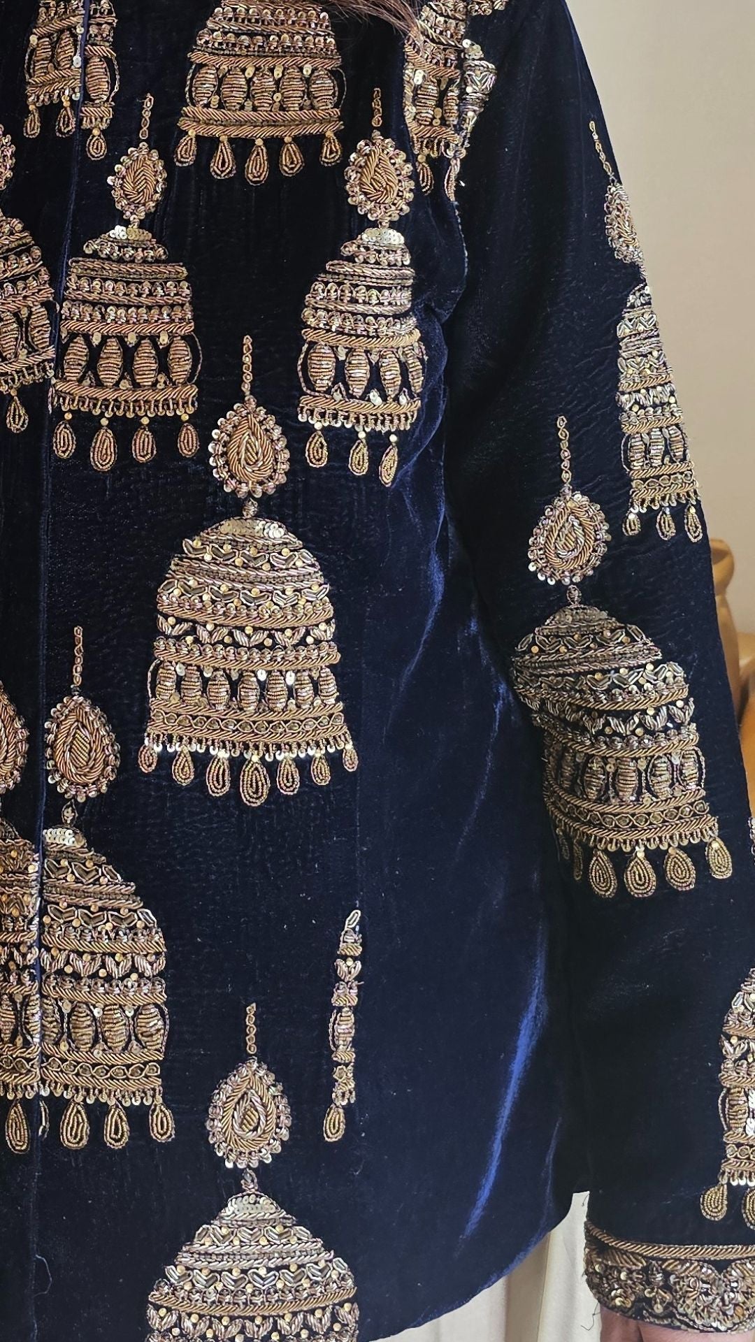 A beautiful velvet hand embroidered Zardozi jacket with satin drape skirt