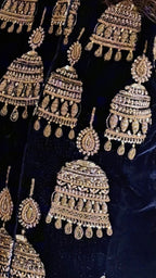 A beautiful velvet hand embroidered Zardozi jacket with satin drape skirt