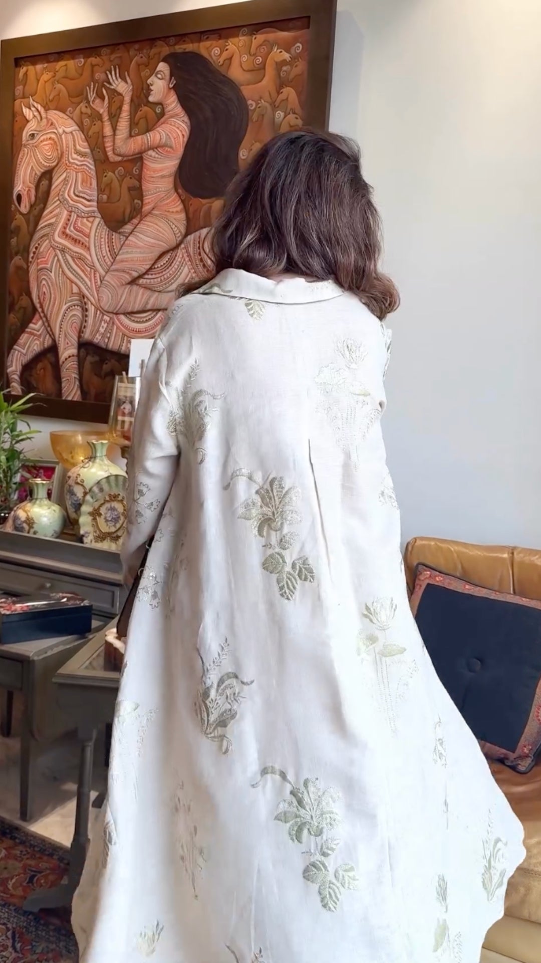 Asymmetric linen outfit featuring elegant gold embroidery, a stylish asymmetric cut, and linen pants with box pleats