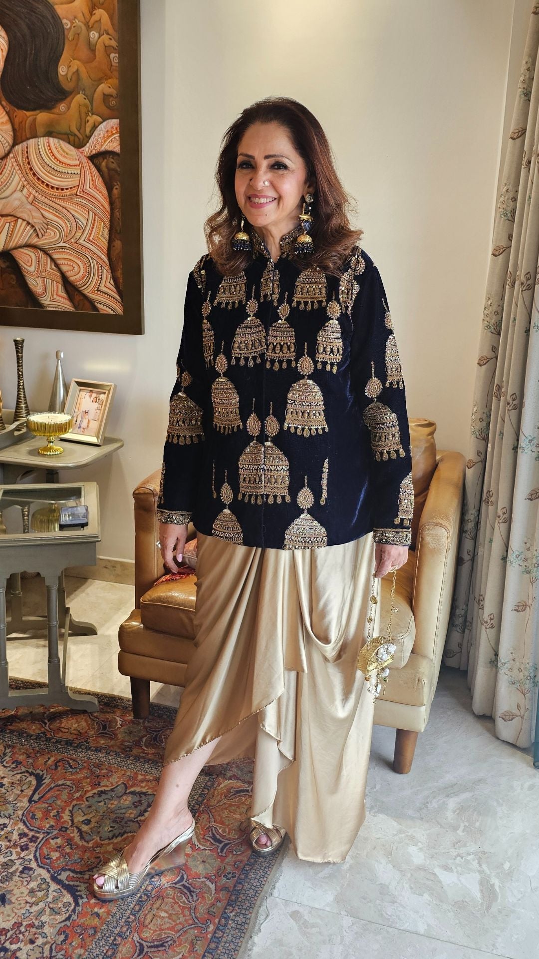 A beautiful velvet hand embroidered Zardozi jacket with satin drape skirt