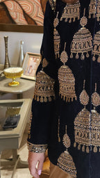 A beautiful velvet hand embroidered Zardozi jacket with satin drape skirt